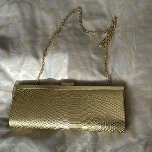 Gold snake style clutch with concealable gold chain